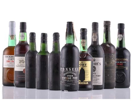 A collection of mixed vintage Port, comprising three half bottles of 1960 Dow, a bottle of Sandeman Fine Tawny Port, a 1975 W