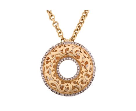 An annular pendant on chain, consisting of a hollow torus with scrollwork designs, embellished with diamond borders at the ri