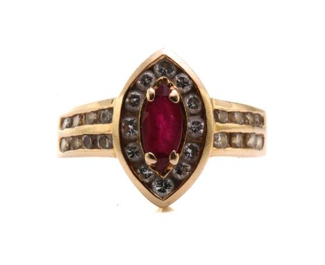 A 14ct yellow gold, diamond, and ruby ring, centred with a marquise-cut ruby measuring approximately 7.7 x 3.7 mm, within a b