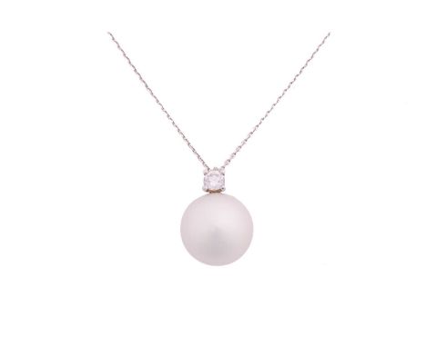 A south sea pearl necklace, featuring a round white silver south sea pearl of 13.6 mm, attached to a diamond surmount, on an 