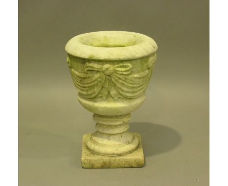 A 20th century carved marble garden urn, the sides modelled with cloth swags, raised on a square base, height 37cm, diameter 