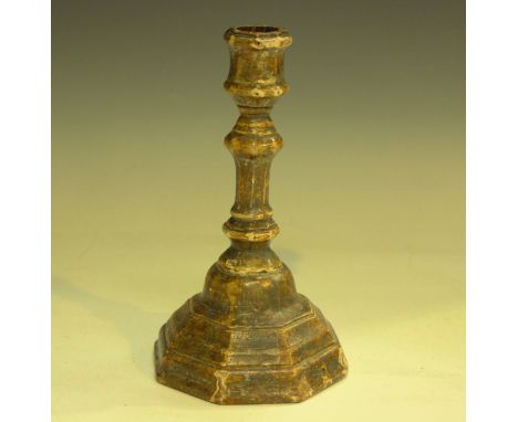 An early 18th century painted gesso and carved softwood candlestick, height 23.5cm.Buyer’s Premium 29.4% (including VAT @ 20%