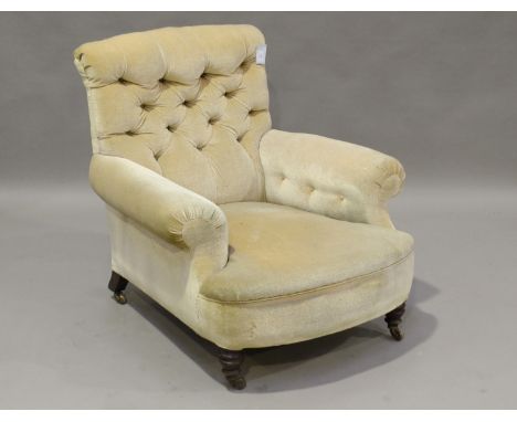 A late Victorian buttoned back armchair, in the manner of Howard &amp; Sons, one rear leg bearing number 'C3586', height 90cm