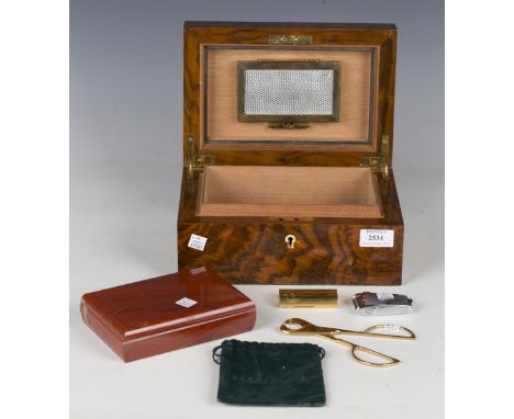 A Dunhill gold plated pocket gas lighter, length 6.5cm, a Ronson lighter, a Solingen cigar cutter, a walnut cased humidor and