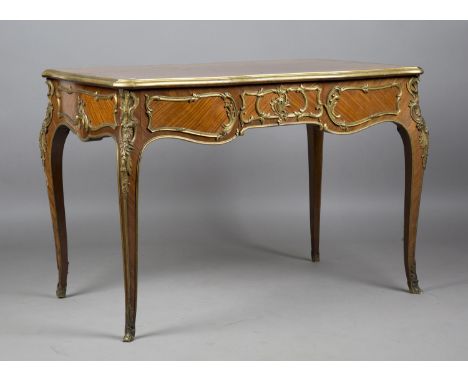 A fine late 19th century Louis XV style kingwood and ormolu mounted bureau plat, the parquetry top above three frieze drawers