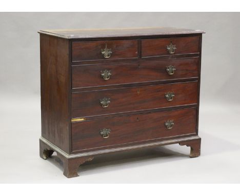 A George III mahogany chest of two short and three long drawers, height 95cm, width 110cm, depth 53cm, together with a matche