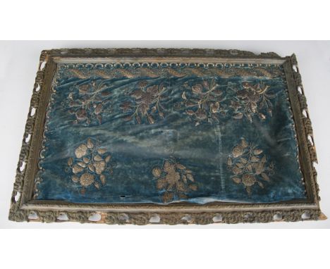 An 18th century blue velvet, silver thread embroidered and sequin appliqué rectangular panel, worked with stumpwork floral sp