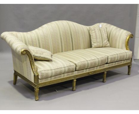 A 20th century giltwood settee, upholstered in modern striped damask, the neoclassical style frame raised on fluted legs, hei