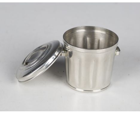 A Cartier pewter 'trashcan' ashtray, formed as a twin-handled lidded dustbin, detailed 'Cartier pewter 7264', with a Cartier 