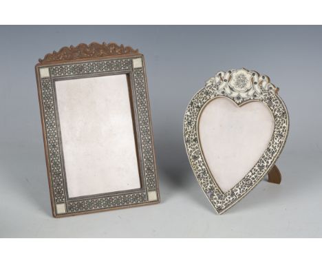 A late 19th century tortoiseshell and engraved ivory frame of heart shaped form, height 20cm, width 15cm, together with a Mid