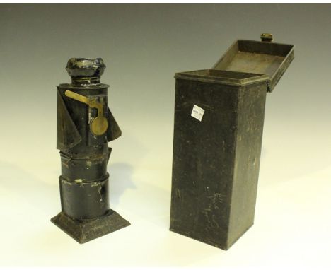 A black painted tin railway lamp, fitted with a folding shade and internal bell, height 26cm, cased.Buyer’s Premium 29.4% (in