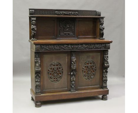 A 19th century oak chiffonier incorporating early carved elements, the shelf back raised on figural supports above a double c