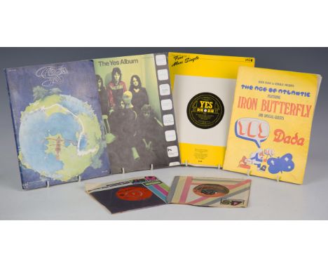 A small collection of material relating to the progressive rock band Yes, including two seven inch single records, sheet musi