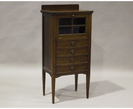 An Edwardian mahogany music cabinet, the lattice glazed door above four drawers, on square tapering legs, height 113cm, width