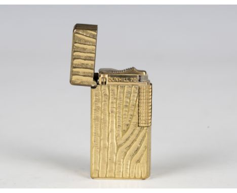 A Dunhill 70 gilt metal pocket lighter, length 5.9cm, cased.Buyer’s Premium 29.4% (including VAT @ 20%) of the hammer price. 