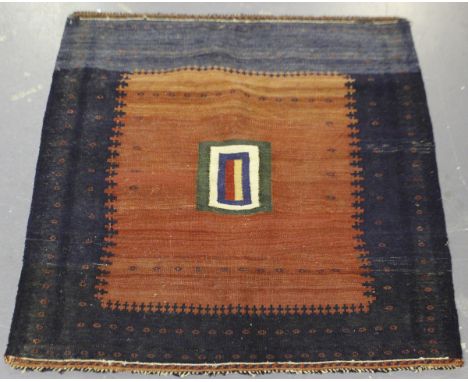 An Afshar Sofreh kelhim, South-west Persia, early 20th century, the shaded red field with a square polychrome medallion, with