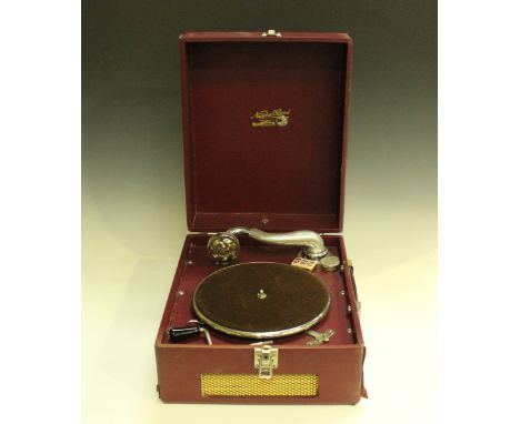 A mid-20th century National Band portable gramophone, finished in burgundy leatherette, width 33.5cm.Buyer’s Premium 29.4% (i