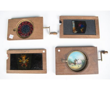A good collection of approximately fifty mahogany framed magic lantern slides, the majority with sliding panels and some mech