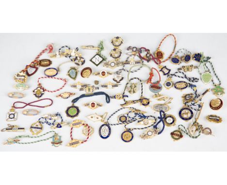 A collection of mainly late 19th and early 20th century enamelled gilt metal horse racing pass badges, including Kempton Park