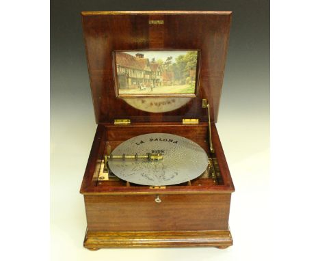 A Polyphon movement, refitted into a later mahogany case, the hinged lid inlaid with a shell, width 39cm, together with a sel