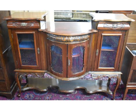 A Mahogany Chiffonier, Demi Lune Centre Cupboard Opening to Reveal Shelved Shaped Shelves, Flanked by Glazed Shelved Cupboard