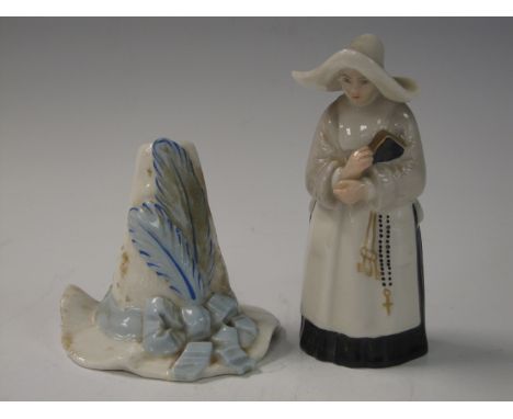 A Royal Worcester Candle Snuffer in the form of Nun, painted black and white detail, puce mark, and Another in the form of Ha