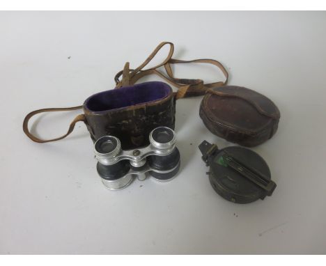 A J. Kohn & Co Santiago Barkers Patent Compass, and a pair of Binoculars, both in leather cases