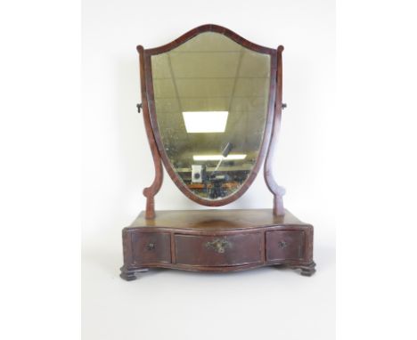 A 19th Century mahogany Dressing Table Mirror with shield shape plate on serpentine fronted platform base fitted three drawer