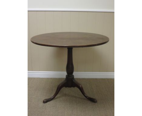 A Georgian mahogany Pillar Table with baluster column and tripod base, 2ft 10in diam