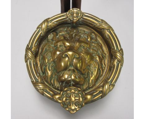 A large cast brass lion mask Door Knocker, 9in