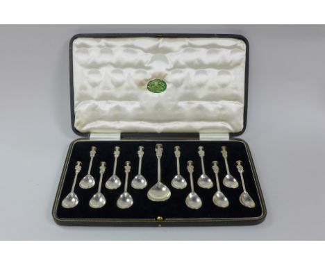 A set of twelve George V silver Apostle Teaspoons and matching larger Spoon with Christ figure finial, Sheffield 1934, boxed