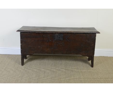 An 18th Century elm Plank Chest carved initials R.K. and date 1705, 3ft 6in, and a mahogany circular Pillar Table on tripod b