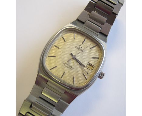A Gentleman’s Omega Seamaster Quartz Wristwatch the textured rectangular dial with hourly applied baton markers, sweep second