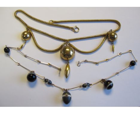 A yellow metal Fringe Necklace with three suspended half globes and droppers on snake chain and a Fringe Necklace with three 