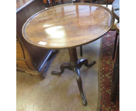 A Georgian mahogany Pillar Table with dished circular top on gun barrel turned column and tripod base, 2ft diam, top split