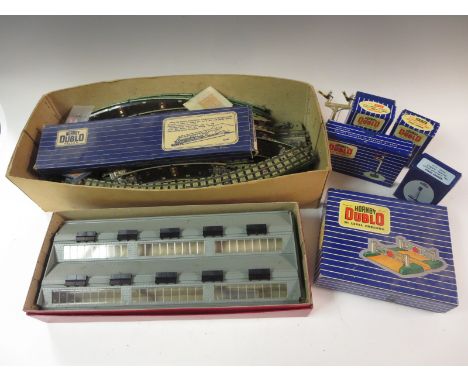 A boxed Hornby Dublo 2-road Engine Shed, boxed loading Gauge, Water Canes, Signals, Level Crossing, Light Signal Switches, Ra