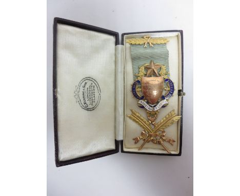 A George V 9ct gold and blue and white enamel Masonic Medal with inscription, ribbon and feathers, Birmingham 1918, in case