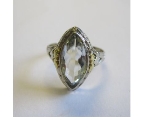 An Aquamarine Ring collet-set marquise-cut stone in pierced mount in yellow and white gold stamped 14K, ring size L 1/2