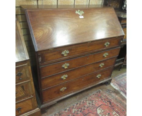 A 19th Century mahogany Bureau fitted four long graduated drawers on bracket supports, 3ft 6in W