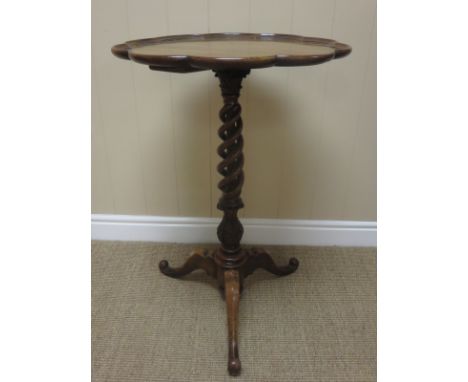 A 19th Century mahogany Pedestal Table with dished petal shaped top on pierced spiral column and tripod base, 19in diam