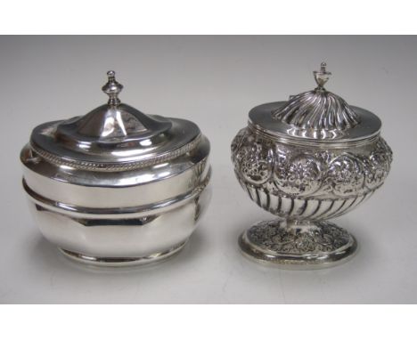 A Victorian silver faceted oval Tea Caddy with hinged lid, London 1899 and an Edward VII silver semi-fluted and floral emboss
