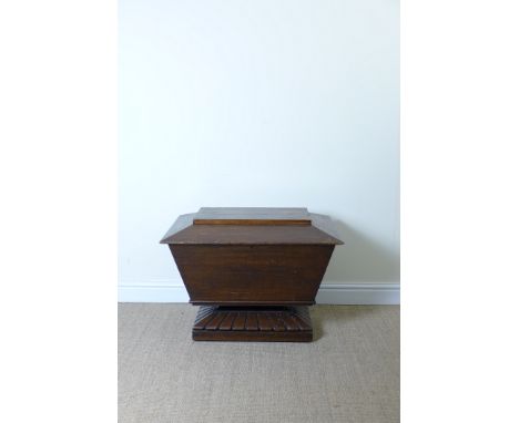 A 19th Century oak Cellaret of sarcophagus form on gadrooned pedestal base, 2ft 7in W