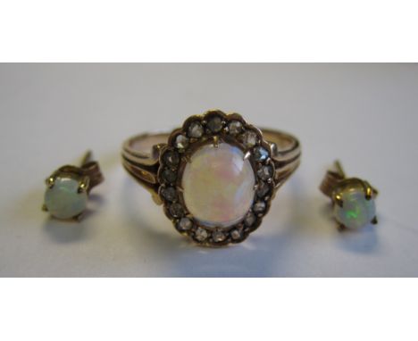 An Opal and Diamond Cluster Ring claw-set oval opal cabochon within frame of pavé-set rose-cut diamonds, ring size M and pair