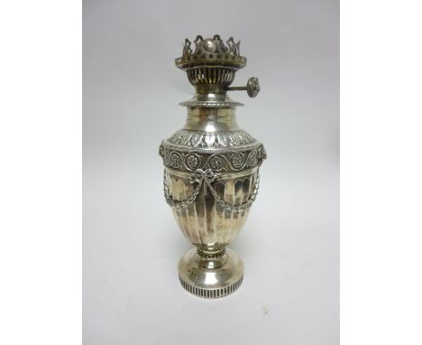 A Victorian silver Oil Lamp with ram’s head masks, swags, leafage frieze, etc, London 1890