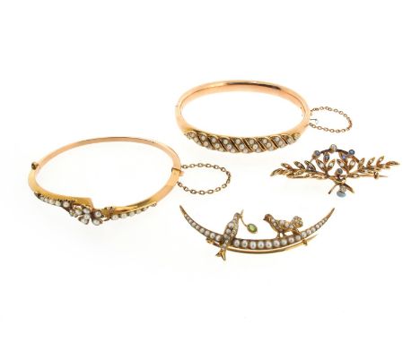 An Edwardian seed pearl set foliate gold hinged bangle, an Edwardian seed pearl set gold open crescent brooch with two birds,