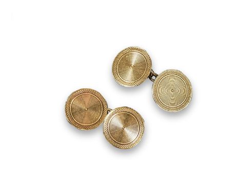 A pair of 18ct gold circular cufflinks, with engine~turned decoration. London hallmarks for 1927. Cased by Harrods.
