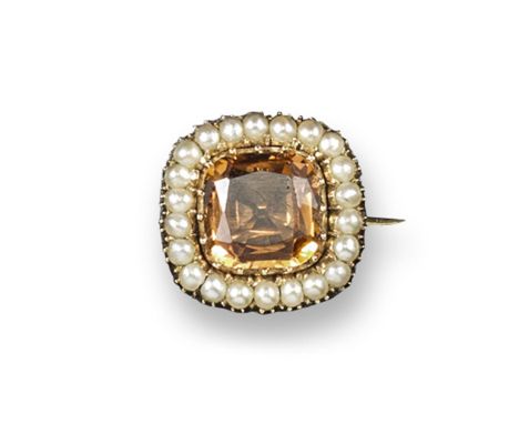 An early 19th century topaz and seed pearl cluster brooch. 1.7cm wide.