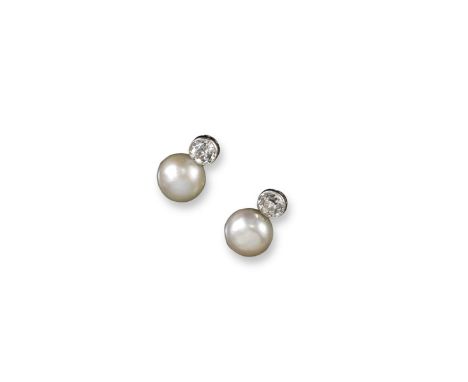 A pair of natural pearl and diamond earrings, each button shaped pearl suspends from an old circular cut diamond, the pearls 