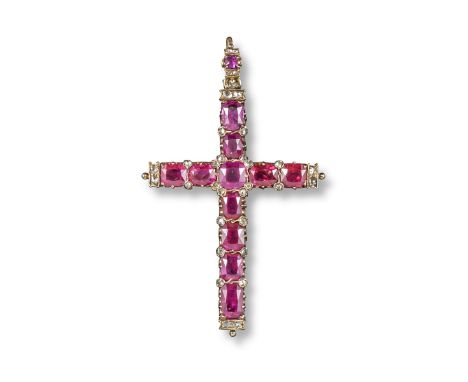 A Burmese ruby and diamond~set cruciform gold pendant, set with eleven oval~shaped rubies and rose~cut diamonds, and a furthe