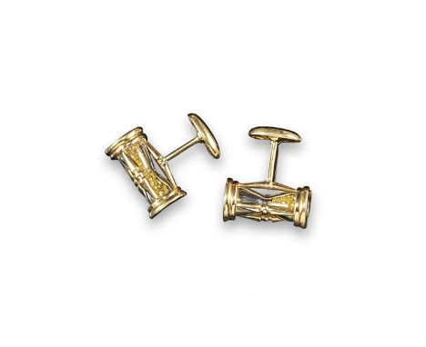 A pair of gold cufflinks in the form of hourglasses, the 'sand' formed with small yellow diamonds. 